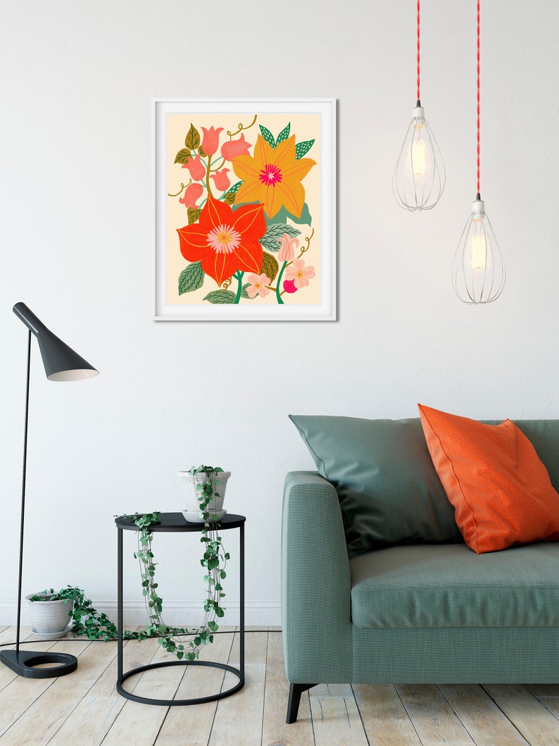 May include: A framed print of a floral illustration featuring orange, yellow, and pink flowers with green leaves on a cream background.