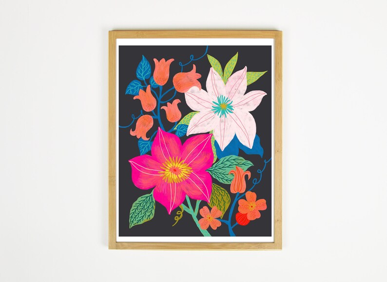 May include: A framed print featuring a colorful floral illustration. The flowers are pink, white, and orange with green leaves on a dark blue background.
