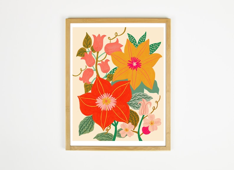 May include: A framed print featuring a colorful floral illustration. The print features a large orange flower with a pink center, a red flower with a pink center, and several smaller pink flowers. The flowers are surrounded by green leaves and vines.
