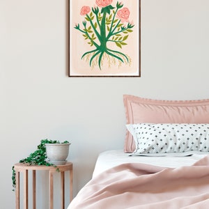 May include: A framed illustration of a pink rose bush with green leaves and roots. The background is a light pink watercolor wash.