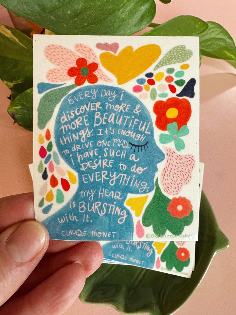 May include: A colorful illustration of a person's head with flowers and text that reads "EVERY Day i discover MORE & MORE BEAUTIFUL things. It's ENOUGH to drive ONE MAD i have SUCH a DESIRE to do EVERYTHING, My HEAD is BURSTING with it. - CLAUDE MONET"
