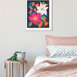May include: A framed print of a floral illustration featuring pink, white, and orange flowers on a black background.