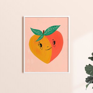 May include: A peach with a smiling face, split in half, with one side yellow and the other red. The peach has green leaves and is on a pink background.