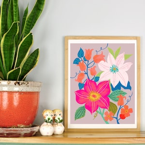 May include: A framed print of a floral illustration featuring pink, white, and orange flowers with green leaves on a light purple background.