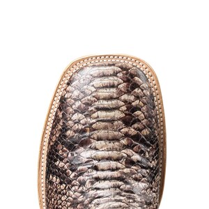 May include: Close-up of a square-toe boot with a snakeskin pattern in shades of brown, tan, and gray. The boot has a light-colored leather trim around the toe.