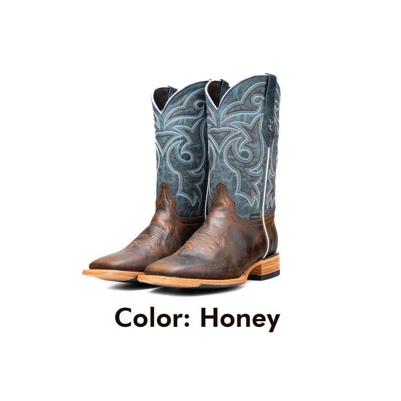 May include: A pair of honey-coloured cowboy boots with a square toe. The boots feature a teal shaft with intricate light blue stitching and a brown leather foot. The text "Color: Honey" is displayed below the boots.