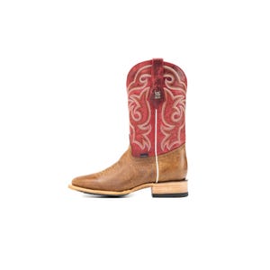 May include: A brown and red leather cowboy boot. The boot has a square toe, a red shaft with decorative stitching, and a brown foot. The shaft has a white trim. The boot is set against a white background.