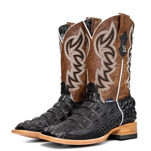 May include: A pair of cowboy boots with a square toe. The boots have a black, textured foot and a brown shaft with decorative stitching. The shaft also features a white border and a small emblem. The heel is approximately 1.5 inches.