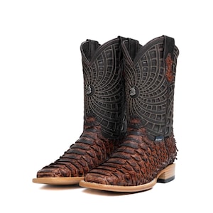 May include: A pair of brown cowboy boots with a textured, scaly pattern on the lower portion and intricate stitching on the upper shaft. The boots have a square toe and a stacked heel, with a decorative emblem on the front.