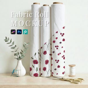 May include: Three vertical fabric rolls with white backgrounds featuring red poppy flower patterns. The text Fabric Roll MOCKUP is visible along with software icons. A white fluted vase with eucalyptus stems and a spool of white thread are present.