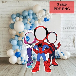 May include: A photo booth prop featuring three superhero characters with face cutouts. The characters are in red, blue, and black costumes. The background includes a balloon arch in shades of blue and white, and the text "3 size PDF-PNG".