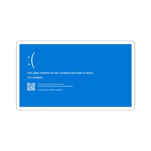 May include: A sticker depicting the Windows "Blue Screen of Death" error. The blue background displays white text: "Your sleep schedule ran into a problem and needs to restart. 12% complete." A sad face icon is also present. The sticker is rectangular.