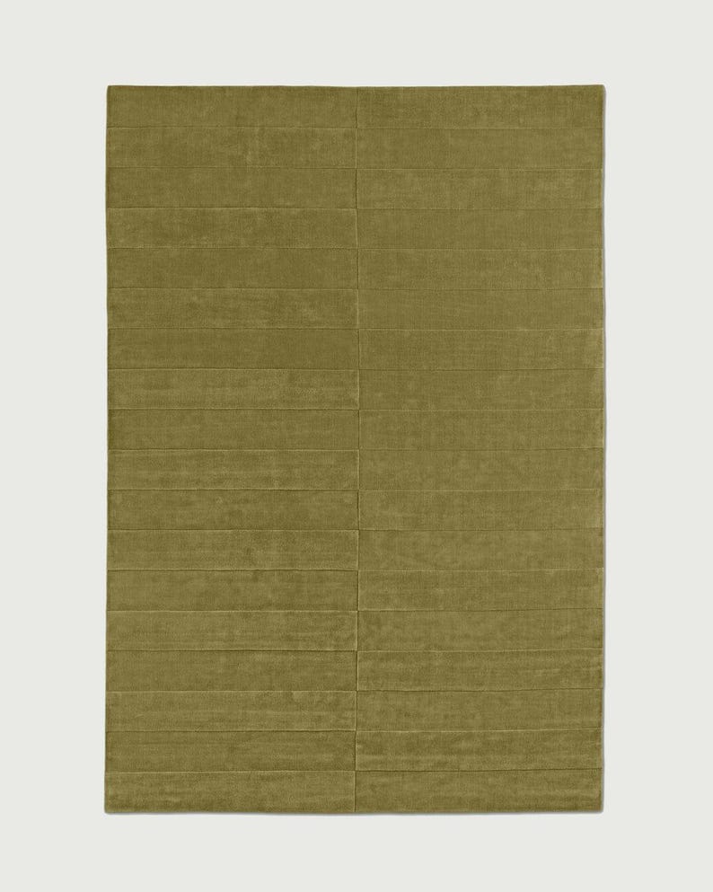 Modern green high low rug for stylish living room
Solid color green rug for minimalist home decor