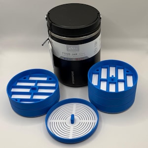 May include: A black stainless steel 32oz food jar with a matching lid and several blue and white food storage containers. The jar has a white label with the text "FOOD JAR 32oz". The jar is designed to keep food hot or cold.