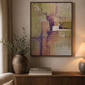 May include: A rectangular framed wall art piece featuring an abstract composition with layered textures in shades of olive green, deep purple, and muted beige. The painting displays geometric blocks and vertical strokes, enclosed in a thin dark frame.