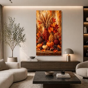 May include: A vertical wall art print featuring a vibrant autumn scene with orange pumpkins, pinecones, and textured vases filled with wheat stalks and red maple leaves. The composition displays a warm colour palette of orange, red, and brown tones.