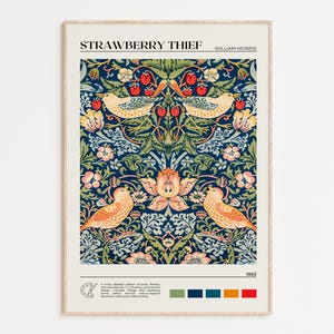 May include: Framed art print titled "Strawberry Thief" by William Morris. The artwork features a detailed pattern of birds, strawberries, and foliage in shades of blue, green, pink, and orange. The print includes the year 1883 and a colour palette.