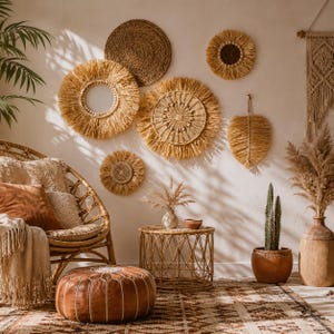 May include: A bohemian-style living room with woven wall decor, a rattan chair, and a leather ottoman. The wall features various circular and leaf-shaped woven pieces. A small round table and a patterned rug complete the decor.