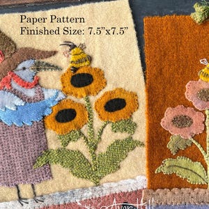May include: Two felted art pieces, each 7.5" x 7.5", feature whimsical bird figures wearing hats, standing near sunflowers and bees. One is on a cream background, the other on orange. The text "Paper Pattern" and "Finished Size" are visible.