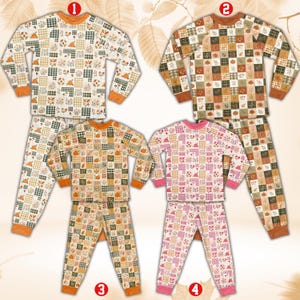 May include: Four sets of long-sleeve pajamas featuring a patchwork grid pattern. Sets 1, 2, and 3 display autumn-themed motifs including pumpkins, leaves, and plaid squares in orange, green, and brown. Set 4 features pink, white, and red floral patterns.