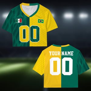 May include: A short-sleeved V-neck jersey featuring a split design of green and yellow. The front displays the Mexican and Brazilian flags with the number 00. The back features the text YOUR NAME above the number 00 in a bold white font.