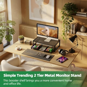 May include: A black metal two-tier monitor stand on a light wood desk. The stand holds a computer monitor, and below are desk organizers with pens and other supplies. A keyboard, mouse, and headphones are also on the desk. The text on the image says: Simple Trending 2 Tier Metal Monitor Stand.