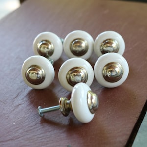 Set of SEVEN 1970's or so White Porcelain KNOBS or PULLS with Silvertone Button Centers
