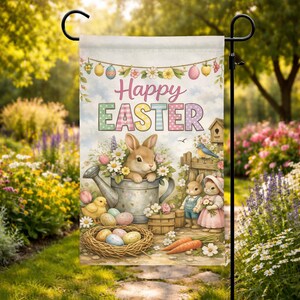 May include: A white ceramic mug with a black handle and the text "But First, Coffee" in a bold, black font. The mug is set against a blurred background, suggesting a cozy setting.