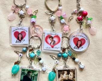 Twilight keychains with charms. Bag charms with Edward and Jacob quotes. Edward and Jacob kiss bag accessory.
