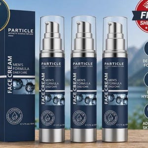 May include: A pack of three Particle Men's Formula Face Cream bottles and a box. The bottles are dark blue with silver accents and clear pump tops. The box has the same design and includes the text "Aesthetic Science for Men".