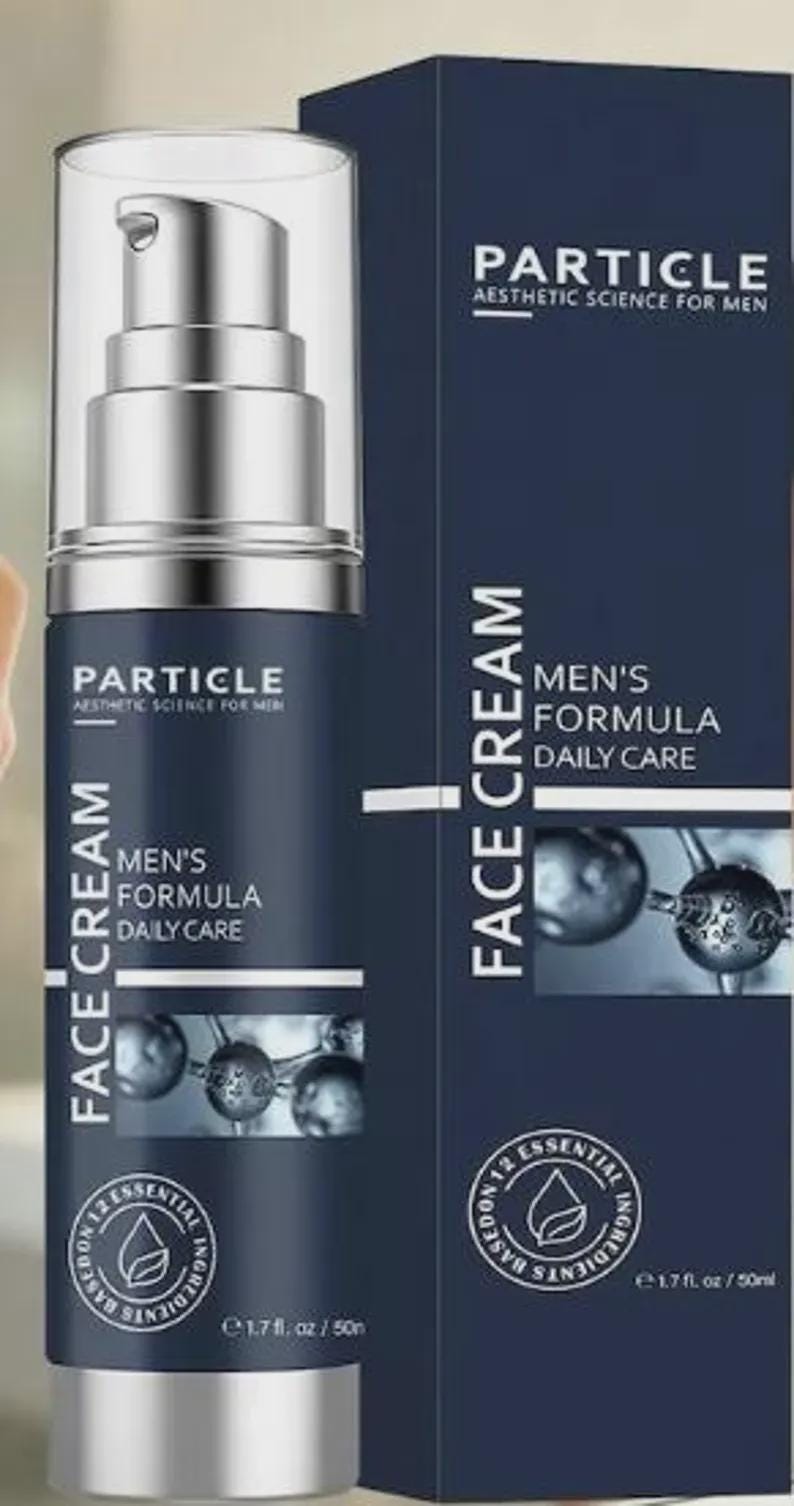 May include: A dark blue bottle of Particle Men's Formula Face Cream with a silver pump dispenser. The product packaging includes the text "Particle Aesthetic Science For Men" and "Men's Formula Daily Care". The bottle contains 1.7 fl oz / 50ml.