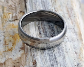 Titanium Wedding Ring with a Solid Platinum Inlay in a Domed Profile, shown in a High Polished - Mirror Finish