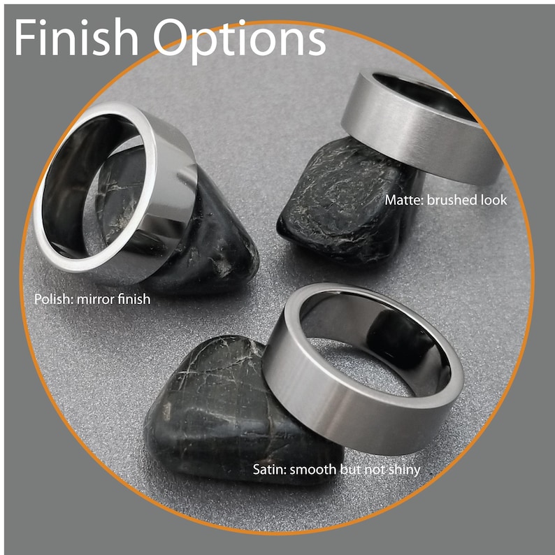 May include: Three silver-toned metal rings labeled Finish Options. One ring has a Polish: mirror finish, one has a Matte: brushed look, and one has a Satin: smooth but not shiny finish. Each ring is positioned on a dark, smooth, rounded stone.