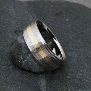 Custom titanium and 18k solid gold wedding ring with our "Sequoia" wood grain finish, available in yellow rose or white gold