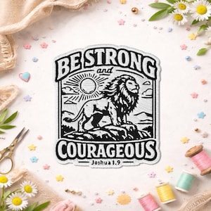 May include: Embroidered patch with the words "BE STRONG and COURAGEOUS" and a lion illustration. The design is in black and white, featuring a lion standing on a rock with a sun in the background. The text "Joshua 1:9" is at the bottom.