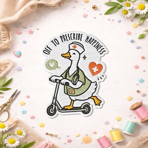 May include: Embroidered patch showing a cartoon goose in a nurse's uniform on a scooter. The patch has the text "Off to Prescribe Happiness" and heart and speech bubble graphics. The goose is white with yellow feet and a green uniform.