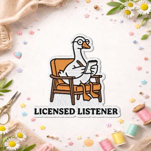 May include: Embroidered patch featuring a cartoon goose wearing glasses and sitting in an orange armchair, holding a notepad and pencil. The patch has the text "LICENSED LISTENER" in black letters on a white background. The patch is surrounded by decorative elements.
