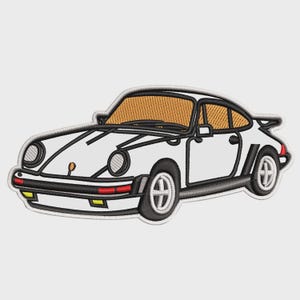 May include: Embroidered patch of a white sports car with black trim and orange tinted windows. The car has a spoiler and round headlights. The patch has a black border and is on a white background.