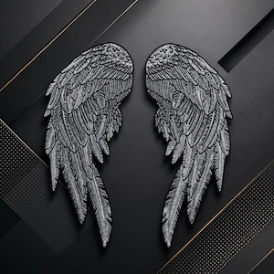 May include: A pair of silver embroidered angel wing patches featuring detailed feather textures and black outlines. The wings are positioned symmetrically, showcasing intricate stitching that creates a metallic, shimmering appearance across the surface.