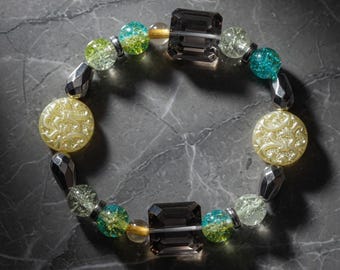 Handmade Beaded Crystal Bracelet – Black Faceted, Teal Crackle Glass, Yellow Carved Beads