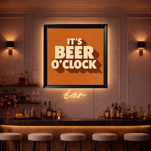 May include: A framed sign with the text "IT'S BEER O'CLOCK" in white letters on an orange background. Below the sign is a neon "bar" sign. The image shows a bar setting with bottles, glasses, and stools.