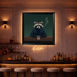 May include: A framed art print depicting a raccoon in a suit, smoking a cigarette, and drinking whiskey. The neon sign below the artwork spells out "bar". The image is set in a dimly lit bar setting.