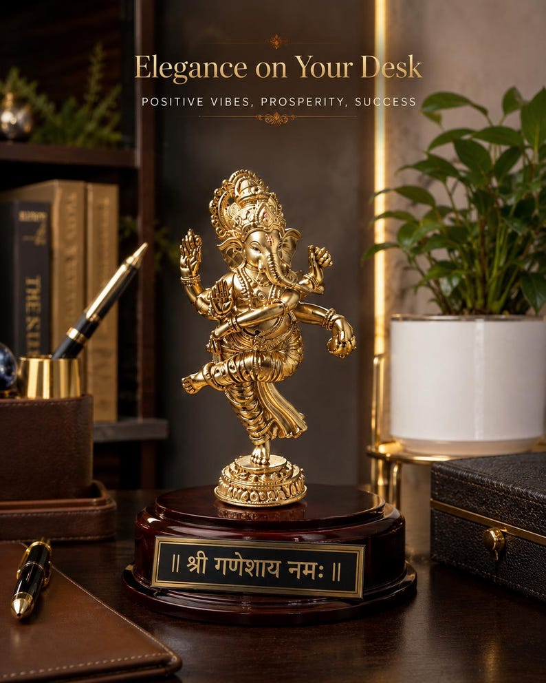 May include: A gold-colored statue of the Hindu deity Ganesha, mounted on a dark wooden base with a gold plaque. The plaque features text in a foreign language. The statue is in a dancing pose. The image includes the text "Elegance on Your Desk" and "POSITIVE VIBES, PROSPERITY, SUCCESS".