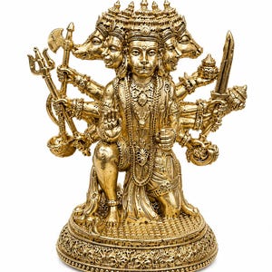 K&ouml;nnte beinhalten: Goldfarbene Statue einer vielgesichtigen Gottheit mit mehreren Armen, die verschiedene Waffen und Gegenst&auml;nde h&auml;lt. Die Statue ist aufwendig detailliert, mit verziertem Schmuck und einem detaillierten Sockel. Die Figur kniet, und das Gesamtdesign ist sehr dekorativ.