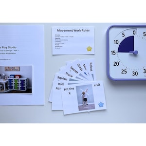 May include: An assortment of educational materials, including a timer, cards, and printed documents. The timer is square with a white face and a purple border. The cards have action words and images. The documents have text and a photo.