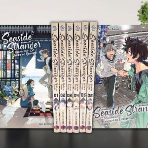 May include: A collection of manga volumes titled "Seaside Stranger" by Kii Kanna. The spines display the series title and volume numbers 01-06. The covers feature colorful illustrations of characters and scenes from the story. The first and last volumes are also visible.