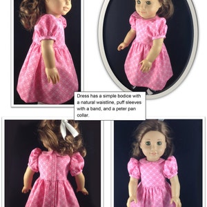 May include: A pink doll dress with a geometric pattern. The dress features a simple bodice, a natural waistline, puff sleeves with a band, and a Peter Pan collar. The dress is displayed on a doll.