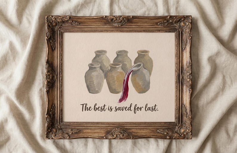 May include: A framed print featuring an illustration of six beige ceramic jars, with dark red liquid pouring from the front-most jar. Below the jars, the text reads, The best is saved for last. The frame is ornate, dark brown, and textured.