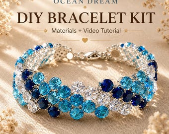 May include: A DIY bracelet kit titled OCEAN DREAM DIY BRACELET KIT Materials + Video Tutorial featuring a multi-row bracelet made of round, faceted, clear, light blue, and dark blue stones set in a silver-toned metal frame with a lobster clasp.