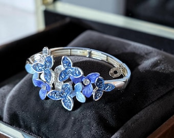 Pre-loved Boxed Equilibrium Elastiacated Blue Flower Design Contemporary Costume Bracelet